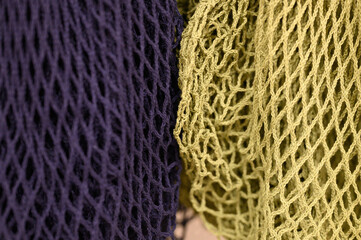 reusable shopping mesh bags purple and yellow colors close up