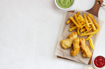 Fish and chips on a white background. British fast food. Recipes. Snack to beer. English cuisine.