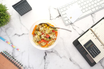 fresh vegetable meal in a bowl on office desk