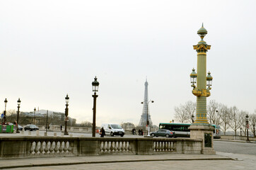 Fototapeta na wymiar Lamp posts on a corner street leading to Tour de Eiffel in Paris, France on a quiet day
