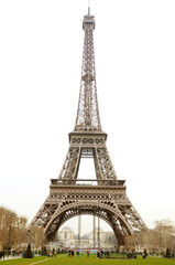 Fototapeta na wymiar Tourist gathering under Tour de Eiffel on a cloudy day.