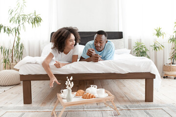Talk and romantic breakfast in bed at home during COVID-19 outbreak or weekend