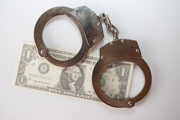 Handcuff above usa dollar. Theft, background