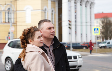 Fototapeta na wymiar married couple walking along a city street
