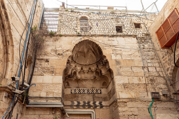 The facade  of a residential building decorated with decorative stucco in the Arabian style and...