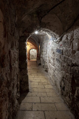 Tunnel  passage under residential buildings in the Muslim quarter near the exit from the Temple Mount - Chain Gate, in the old city of Jerusalem, in Israel