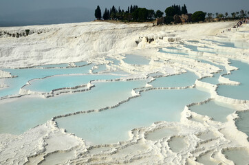 The enchanting Natural travertine pools and terraces in Pamukkale,Turkey. Cotton castle in southwestern Turkey. The site is a UNESCO World Heritage Site.