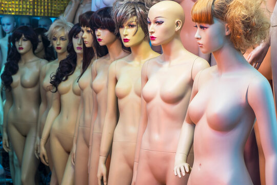 Large group of shop dummies, mannequins, naked female forms. 