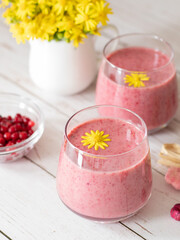 Glasses with frozen cranberry smoothie. Healthy and nutritious milkshake. A delicious drink for a weight loss diet. Vegan and vegetarian plant-based sugarless morning breakfast for flat belly.