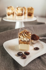 Traditional Italian dessert tiramisu in a glass.