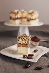 Traditional Italian dessert tiramisu in a glass.