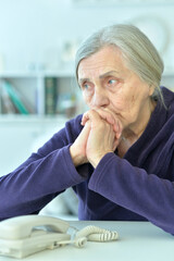 Close up portrait of tired senior woman