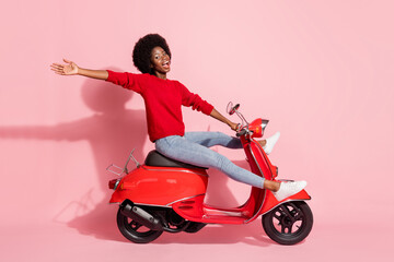 Fototapeta na wymiar Full body profile side photo of dark skin nice happy lady ride bike empty excited isolated on pink color background