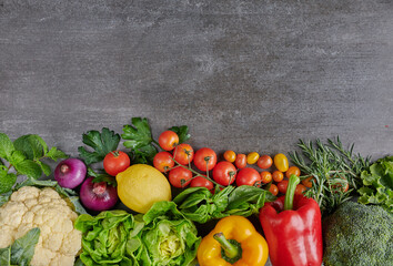 Fresh fruits and vegetables for background, Different fruits and vegetables for eating healthy, Colorful fruits and vegetables isolated on dark background. Copy space. Flat lay. Top view.