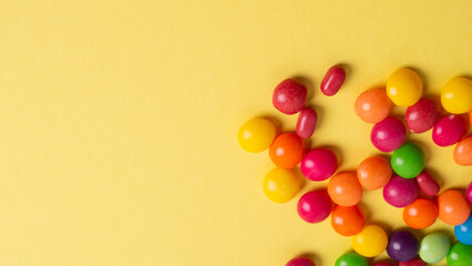 Obraz premium background, blue, board, bright, candies, candy, childhood, chocolate, closeup, coated, colorful, concept, confectionery, copy, delicious, dessert, easter, eat, food, fun, holiday, isolated, juicy, ma