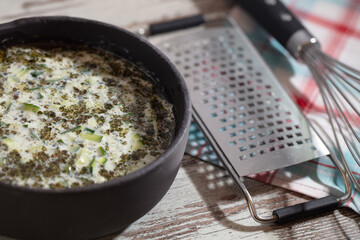 Yoghurt sauce tzatziki with herbs, cucumber and garlic, top view