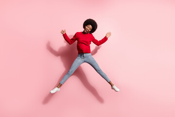 Fototapeta na wymiar Full length body size view of attractive cheerful girl jumping having fun enjoying good mood isolated over pink pastel color background