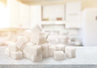 Cubes of white sweet sugar on the desk