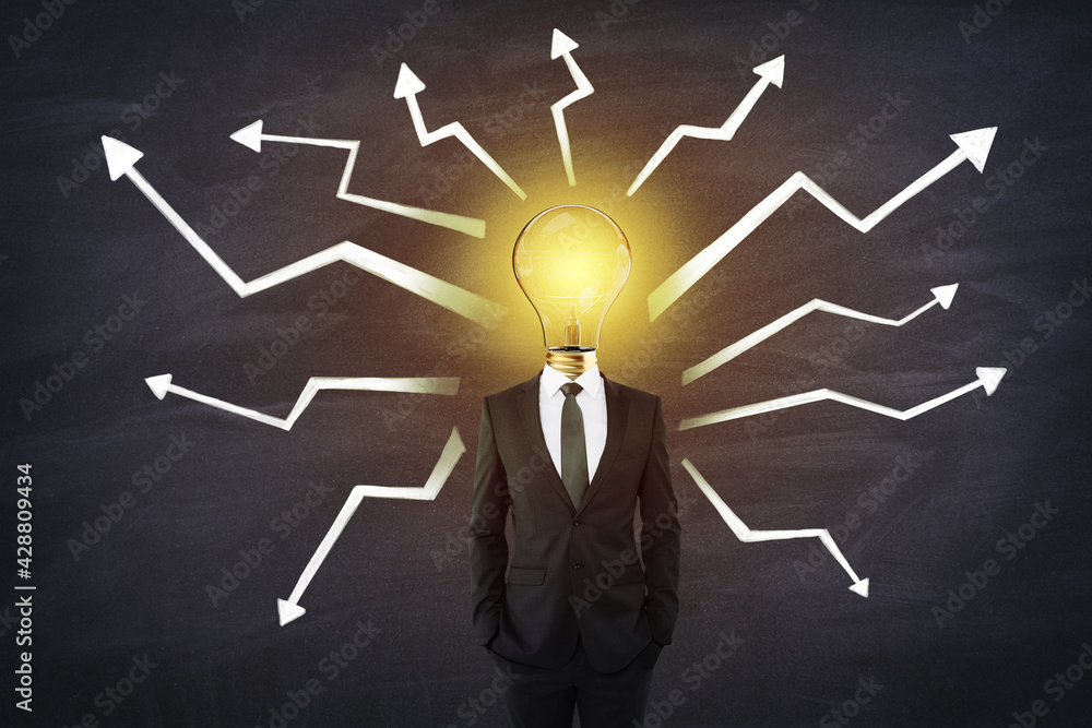 Aufkleber Idea concept with man in black suit and glowing light bulb instead of head with white arrows directed in different directions on black background
