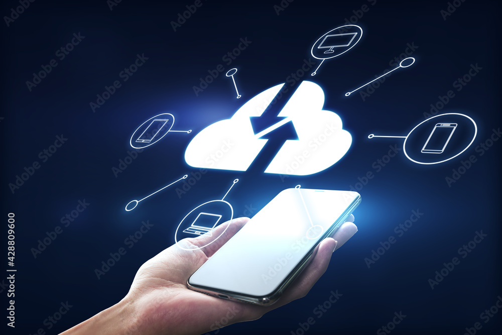 Poster Mobile technologies concept with modern smartphone in man hand and virtual projection of cloud silhouette, arrows on it and mobile items icons around on dark background