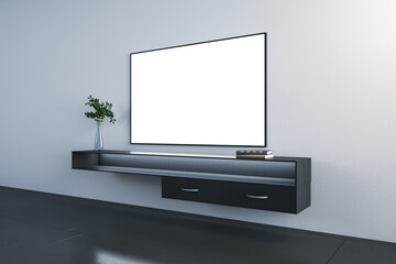 Blank white tv set with a desk under it on a concrete wall, concrete black floor, interior design concept, mock up, 3d rendering