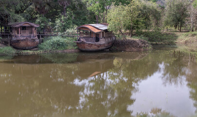 Two traditional house boats that was moored on the edge of the canal. Selective focus