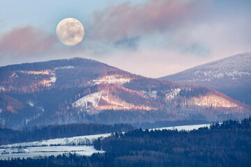 Snieznik Massif, moonrise over the mountains in the Sudetes.