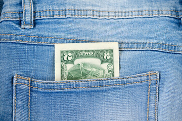 dollars money in denim pocket