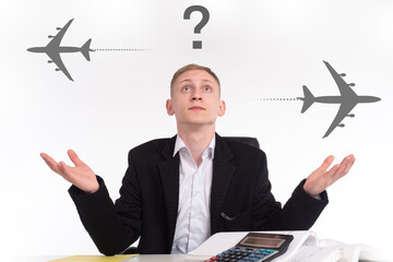 Search for optimal air route. Concept - man chooses best route for a flight. Question mark next to a businessman. Man in business suit chooses a flight for an air flight. Choice of air travel