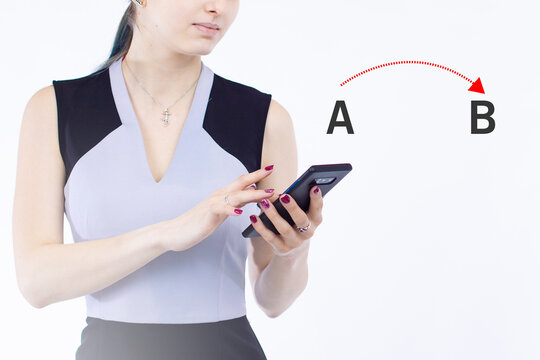 Application For Building Route Concept. Moving From Point A To Point B. A Woman Is Using Some Kind Of Application On Her Phone. She Builds Route Through Smartphone. Letters A And B Are At Near Girl