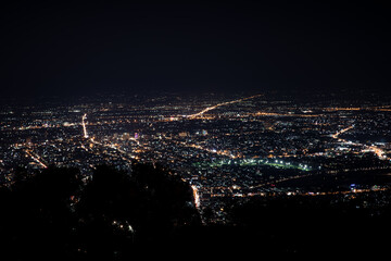 Naklejka premium Aerial view of the night light cityscape of Chiang mai, Thailand