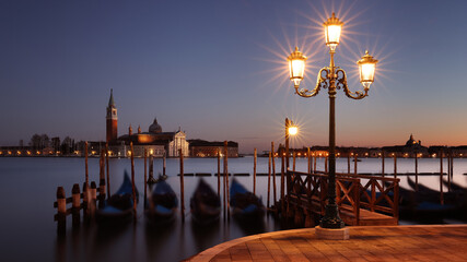 Piazza San Marco and waterfront promenade at sunset in Venice, Italy