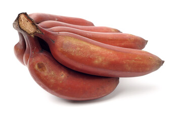 ripe tropical tasty red bananas on white background