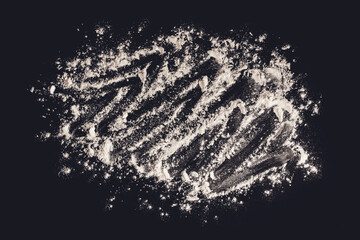 Flour. Dough preparation. Black background. View from above.