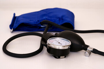 Blood pressure measuring device on a white table.
