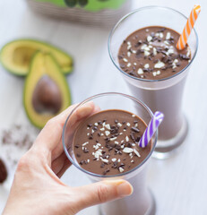 Creamy avocado banana chocolaty smoothie for healthy vegan breakfast or post-workout snack.