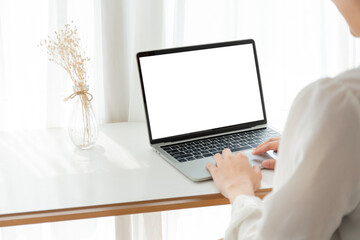 computer screen blank mockup.hand woman work using laptop with white background for...