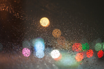 Blurred background with raindrops and lights.