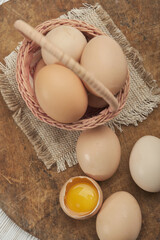 Fresh eggs in a rustic basket