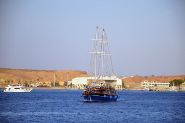 Sail boat ship with tourists in Ras Mohamed National Park in the Red Sea, Sharm El Sheikh, Egypt \