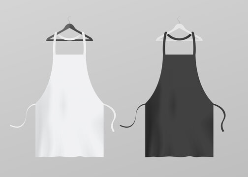 Two kitchen aprons hanging on hangers, realistic vector illustration isolated.
