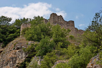 Fototapeta na wymiar Exterior view of the ruins from Stone fortress tower from of the medieval town of Cherven in Bulgaria 
