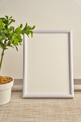 blank frame on a table ready to write something nice to dedicate to a loved one