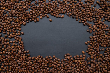 coffee beans on old black wooden table background. mockup and templates to create greeting, cards, magazines, cover, poster and banners etc. space for text. top view. flat lay