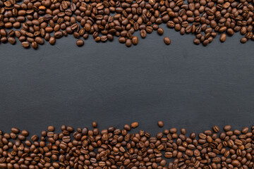 coffee beans on old black wooden table background. mockup and templates to create greeting, cards, magazines, cover, poster and banners etc. space for text. top view. flat lay