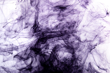 Abstract background picture with purple ink dissolving in water