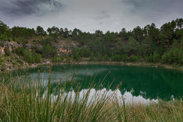 Views of the Gypsy Lagoon, a karstic lake located in the Natural Monument of Cañada del Hoyo Lagoons, province of Cuenca, Spain