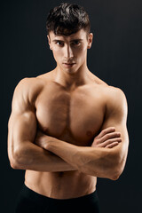 Fototapeta na wymiar bodybuilder muscular naked body studio dark background