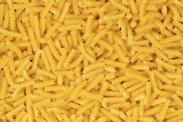 raw spiral pasta background texture