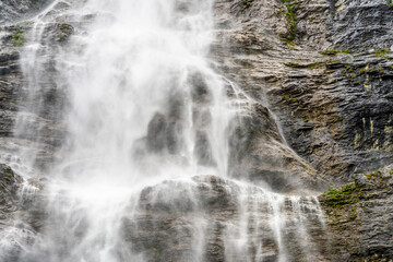 Fototapeta na wymiar Mountain waterfall near Murren, Switzerland